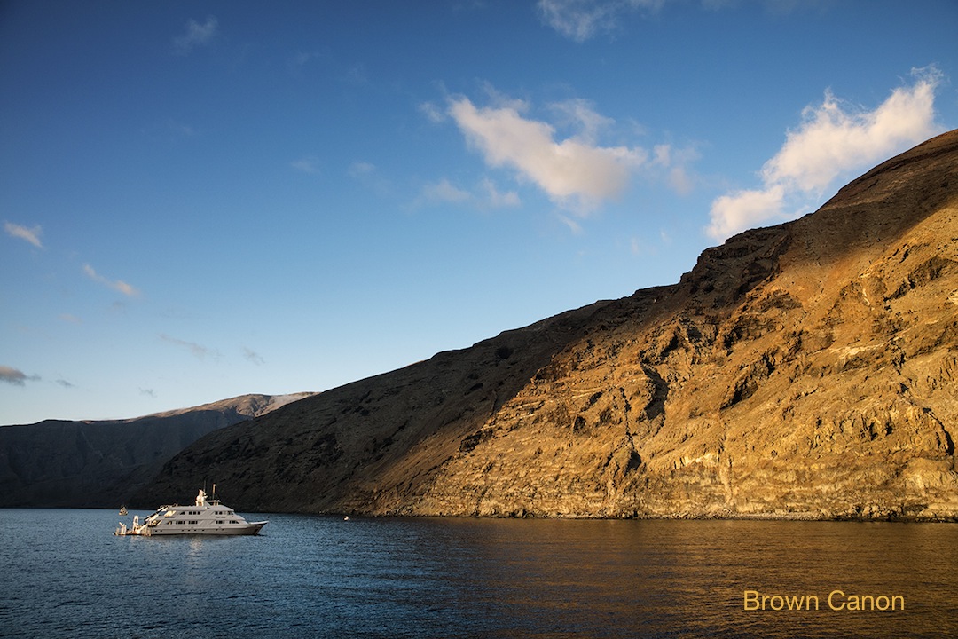 sunrise at Guadalupe island with the Nautilus Belle Amie in the background