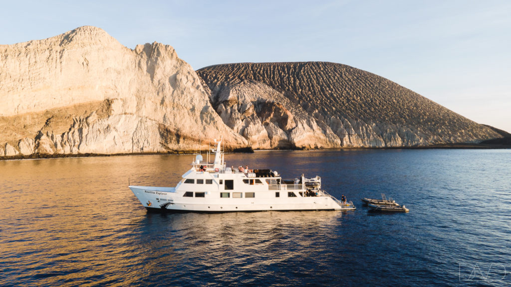 Nautilus Explorer liveaboard boat floating in front of the spectacular Socorro Islands